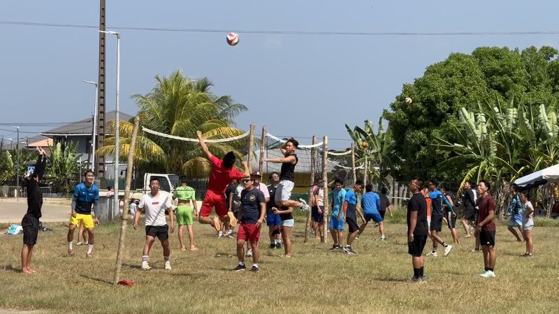 An intense volleyball match underway in Javouhey, where young people show off their talents during the youth festival.